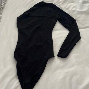 Black, asymmetrical bodysuit